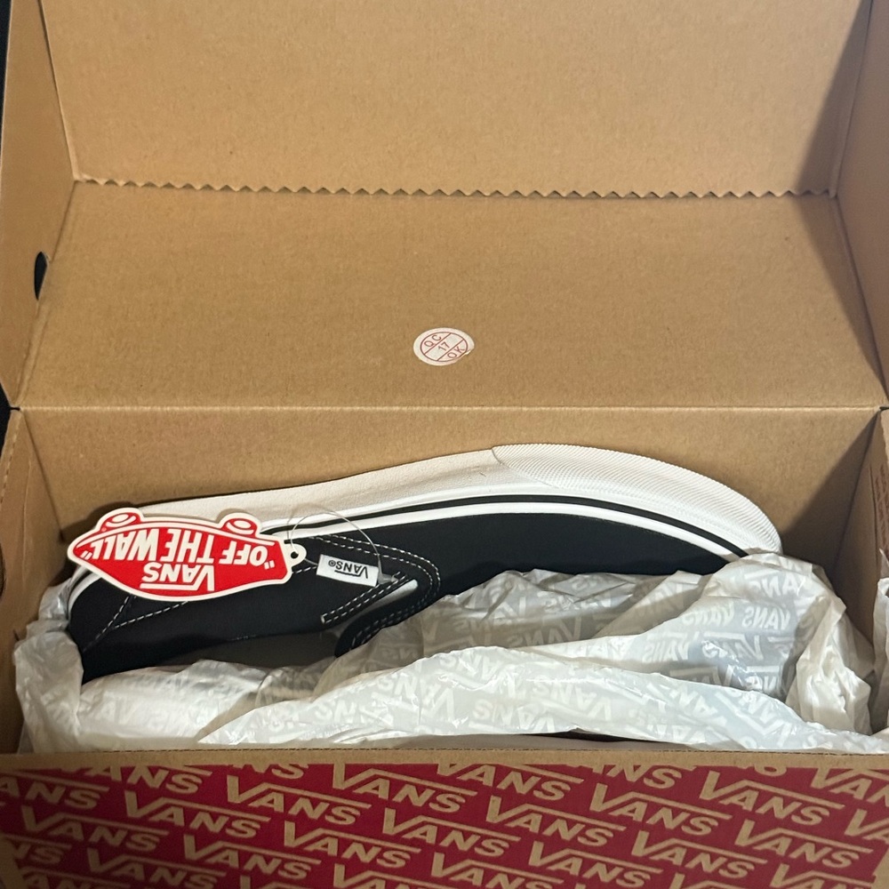Vans Slip on Black and White Sneakers men’s size 7, women’s size  8.5. Brand New